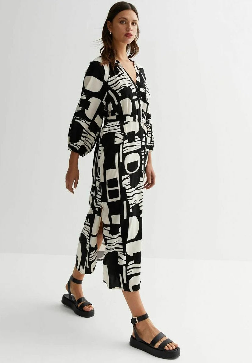 Monochrome Muse Wrap Dress – Black & Ivory Geometric Print